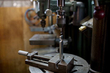 Part machining with drilling machine