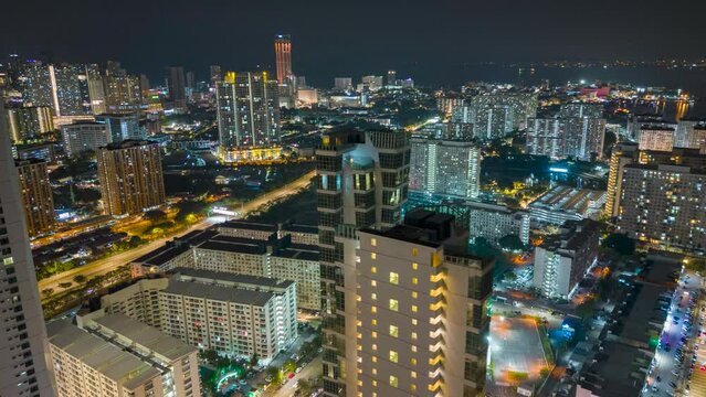 Drone circular Karpal Singh Drive condominium and apartment resident area in night. Penang night scene