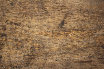 Background of a solid untreated board. The timber has a pronounced woody texture. Old floor board...