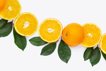 Orange fruit with green leaves on white background.