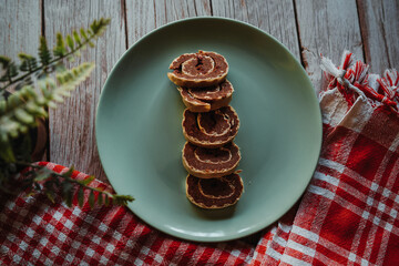 Top and side view of homemade cookies on wooden background on a plate 
