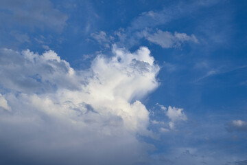 White clouds against blue sky background