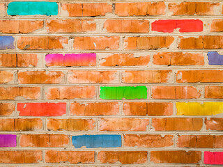 The texture of an old brick wall with stylized multi-colored bricks. Original illustration of a wall made of red, yellow, turquoise, blue, light green, purple gradient bricks. For designers
