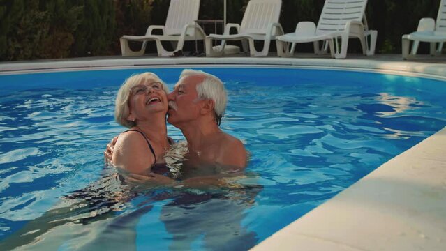 Senior Couple In The Swimming Pool