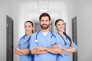 Team of smart medical students in college hallway