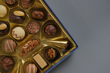 Assorted chocolate candies in a box. Chocolate box. Milk chocolate candy.Sweets and desserts.Sweets box in assortment