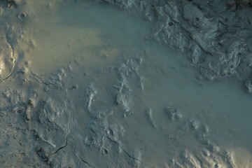 Ground mud as background, view from above