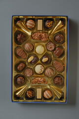  chocolate candies box on a gray background. Chocolate box. Milk chocolate candy.Sweets and desserts.Sweets box in assortment