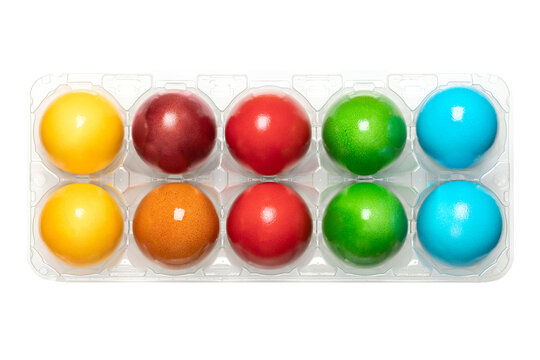 Colorful Easter eggs, colored Paschal eggs, in a clear plastic egg box. Hard boiled, dyed chicken eggs, used to celebrate the resurrection of Jesus during Eastertide. Symbol for fertility and rebirth.
