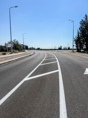 Fototapeta na wymiar Road with traffic island in city