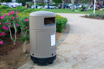 View of trash bin on city street