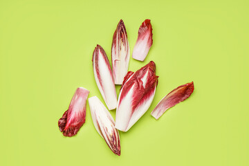 Bunches of fresh red endive on green background
