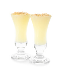 Shots of delicious pudding with vanilla sticks isolated on white background