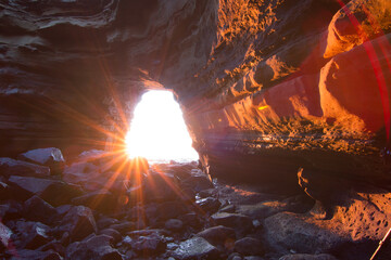 sunset through cave