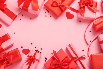 Frame made of gifts for Valentine's Day celebration on pink background