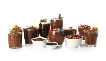 Glasses and bowls of various chocolate pudding isolated on white background