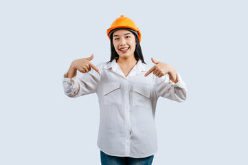 Young female engineer in helmet stand with thumb up posture