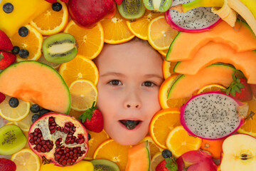 Fototapeta na wymiar Vitamins from fruits. Mix of fruits near kids face. Assorted mix of summer fresh fruits. Healthy nutrition for kids.