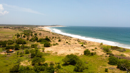 Top view of a beautiful sandy beach and ocean with waves. Peanut Farm Beach. Sri Lanka.