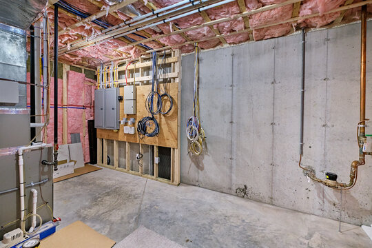 Basement mechanical room with electrical, plumbing, network and heating systems