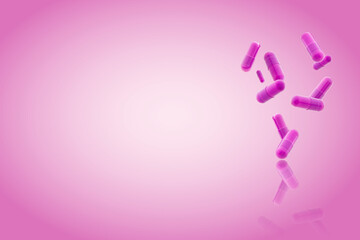pink medical gel capsules falling down on red background. food supplement, pharmacy concept. plastick capsules pills