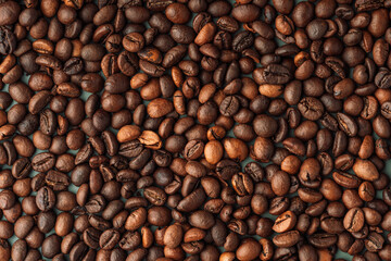 Background coffee beans a lot closeup.