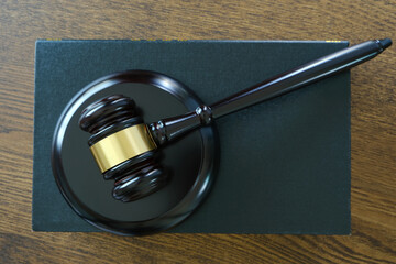 Judge hammer and law books on wooden table justice and legal concept put the law book concept and...