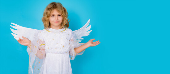 Christmas kids. Little cupid angel child with wings. Studio portrait of angelic kid. Banner design, poster template.