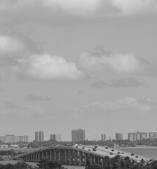 timelapse of clouds over city bridge black and white miami 
