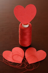 Hearts bound by threads of fate. Third heart involved. Valentine's Day. In love