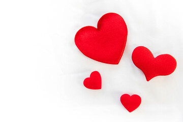 Heart shape with Gift box packed for honeymoon lover on white bed honeymoon suit.Valentine's day concept. Beautiful blurry background.heart lay on the bed.
