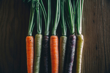 Close-up of colorful carrots on wooden table