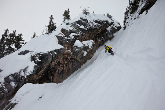 A telemark skier in a narrow chute in Montana.