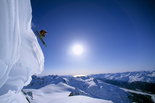 A skier jumps a cornice, Cordova, Alaska.