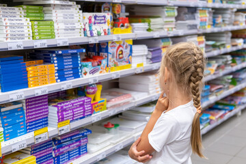 Chelyabinsk, Russia, August 2022. A little girl chooses school supplies in a store in Chelyabinsk, Russia.