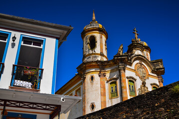 A partial view of the São Francisco de Assis church and a corner colonial house in Ouro Preto, Minas Gerais state, Brazil