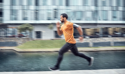 Blurred, fitness and man running as exercise in the city training, workout and workout outdoors in...