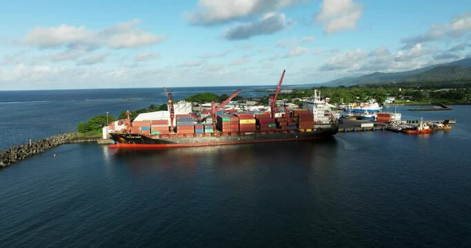 Apia Harbour With Commercial Shipping Port And Container Ship In Upolu Island, Western Samoa, South Pacific - aerial drone shot