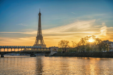 Fototapeta na wymiar Paris France sunrise city skyline at Eiffel Tower and Seine River Bir-Hakeim Bridge