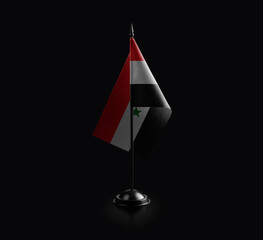 Small national flag of the Syria on a black background