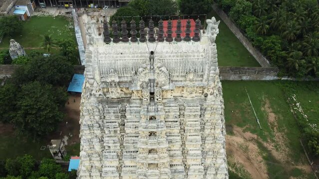 Aerial view of Hindu temple tower. Close-up of the beautiful temple tower with God, and animal sculptures which are carved and sculpted mostly out of sandstone.