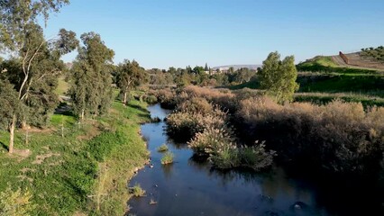 Lash green during the winter- the Jordan river- Yardenit baptism holy Christian site- Religious tourism- Northern Israel