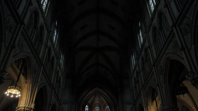 Revealing shot of a stunning cathedral in Rotterdam revealing the alter and rows of pews