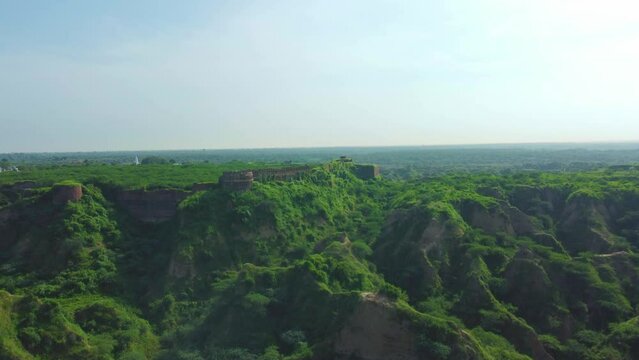 Aerial drone shot of an Abandoned ancient fort on top of a forest hill in Dholpur , Rajasthan , India