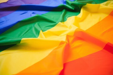 waving colorful rainbow gay flag . macro shot