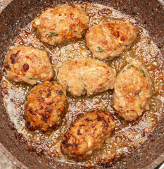 Minced meat cutlets are fried in a frying pan