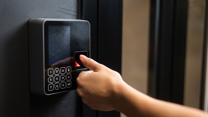 A woman opens the door with her fingerprint. Modern keyless entry lock. 