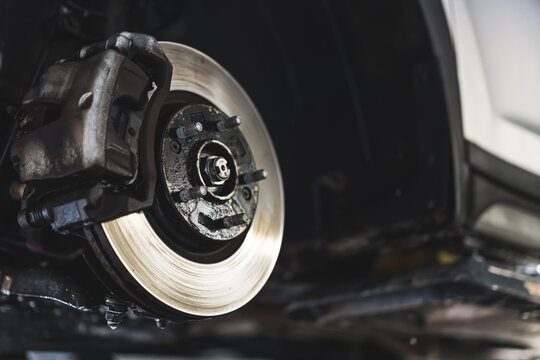 Closeup disc brake of vehicle for repair - Tire replacement car brake repairing. High quality photo