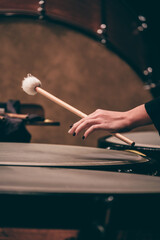 Indoor concert background abstract people performing music instruments Timpani in symphony orchestra