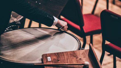 Indoor concert background abstract people performing music instruments Timpani in symphony orchestra © Michael